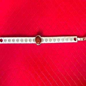 Silver tone mesh bracelet.